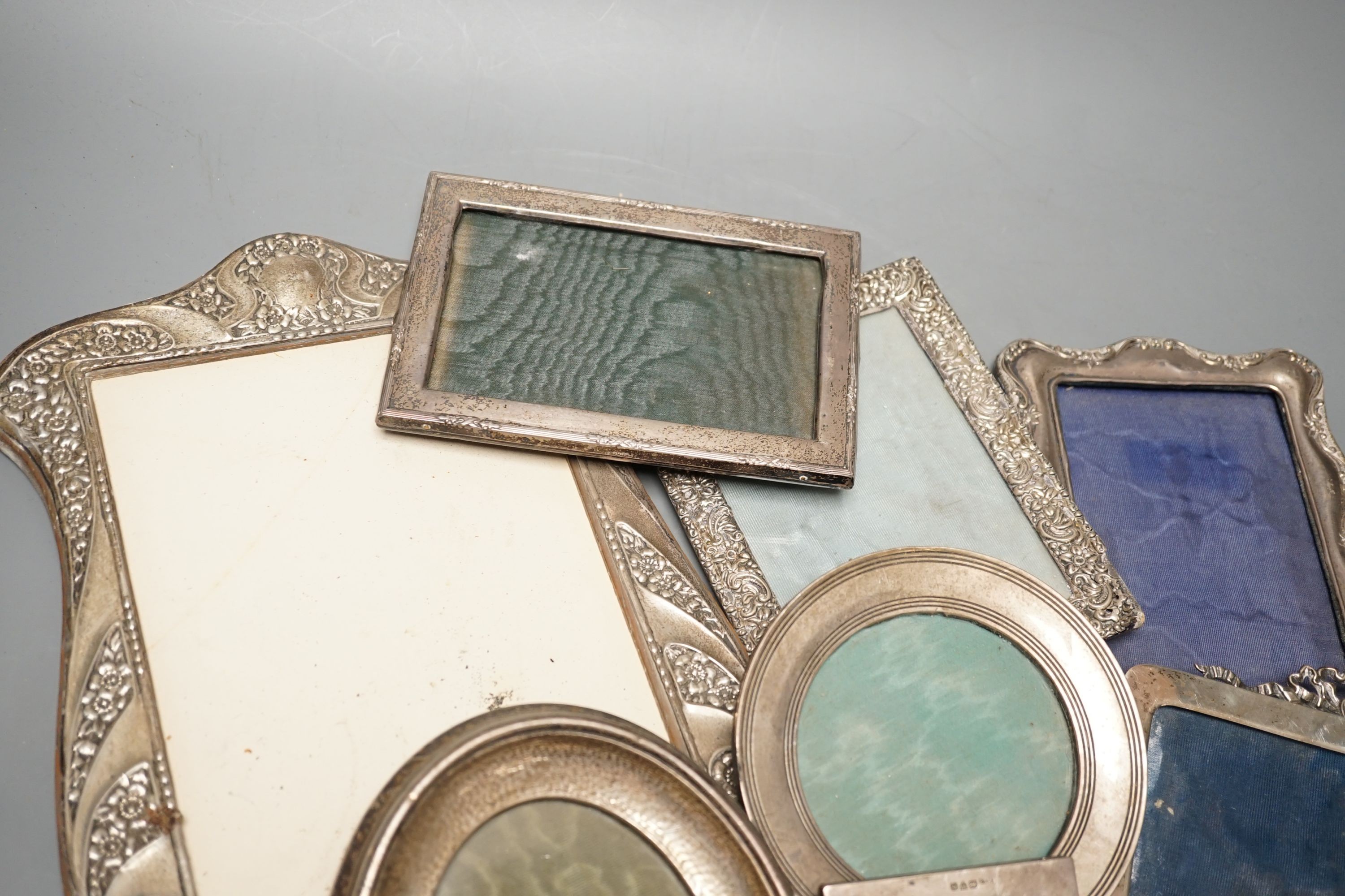 A mixed group of eight various small silver mounted photograph frames, largest 29cm and dated for Birmingham, 1911.